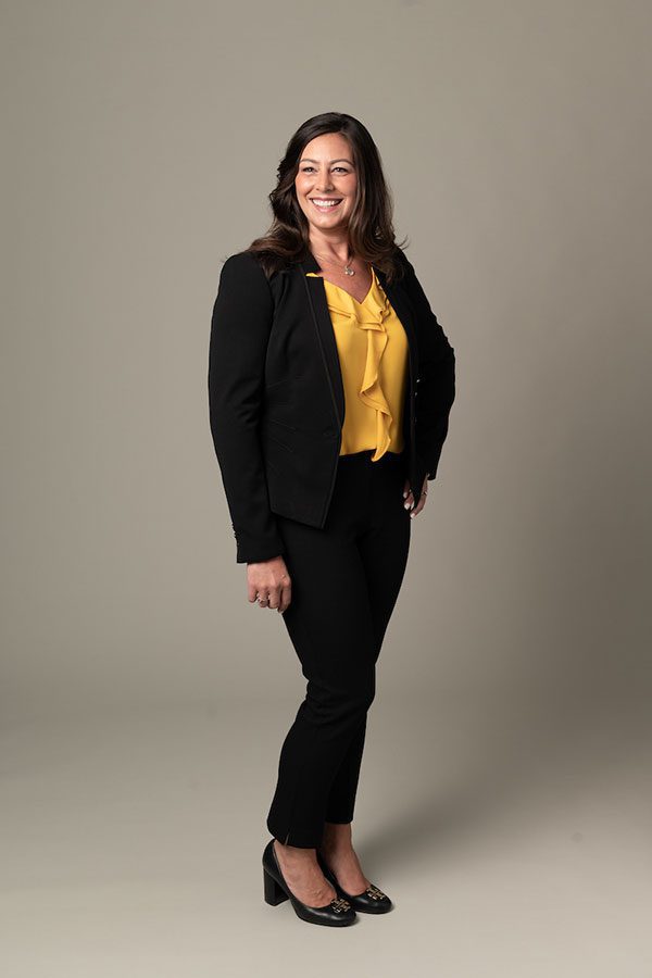 Professional woman in yellow blouse