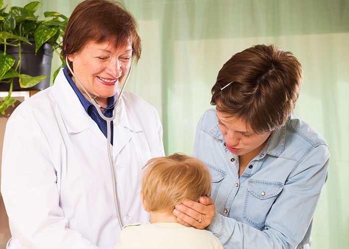 Doctor, parent, and child at a check-up